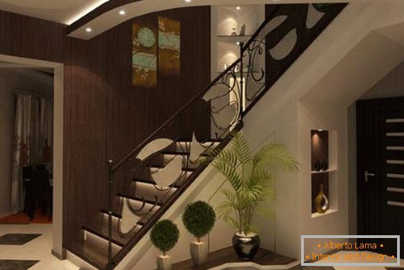 Дизајн улазне хале с степеништем у приватној кући у тамним тоновима